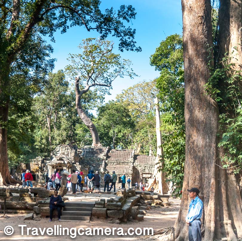 That's the first view you get at Ta Prohm, when you enter through the East Gate. If you see carefully there is a huge tree sitting on the top of this Temple. But when I go to the back side, you realise that the tree has grown through the cracks of the structure and then broke the structure apart.