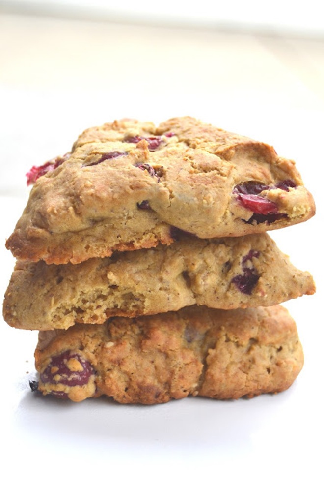 These Cranberry Scones with Coconut Vanilla Drizzle are made healthier with whole-wheat flour, yogurt, fresh cranberries and a healthier yogurt based drizzle! www.nutritionistreviews.com