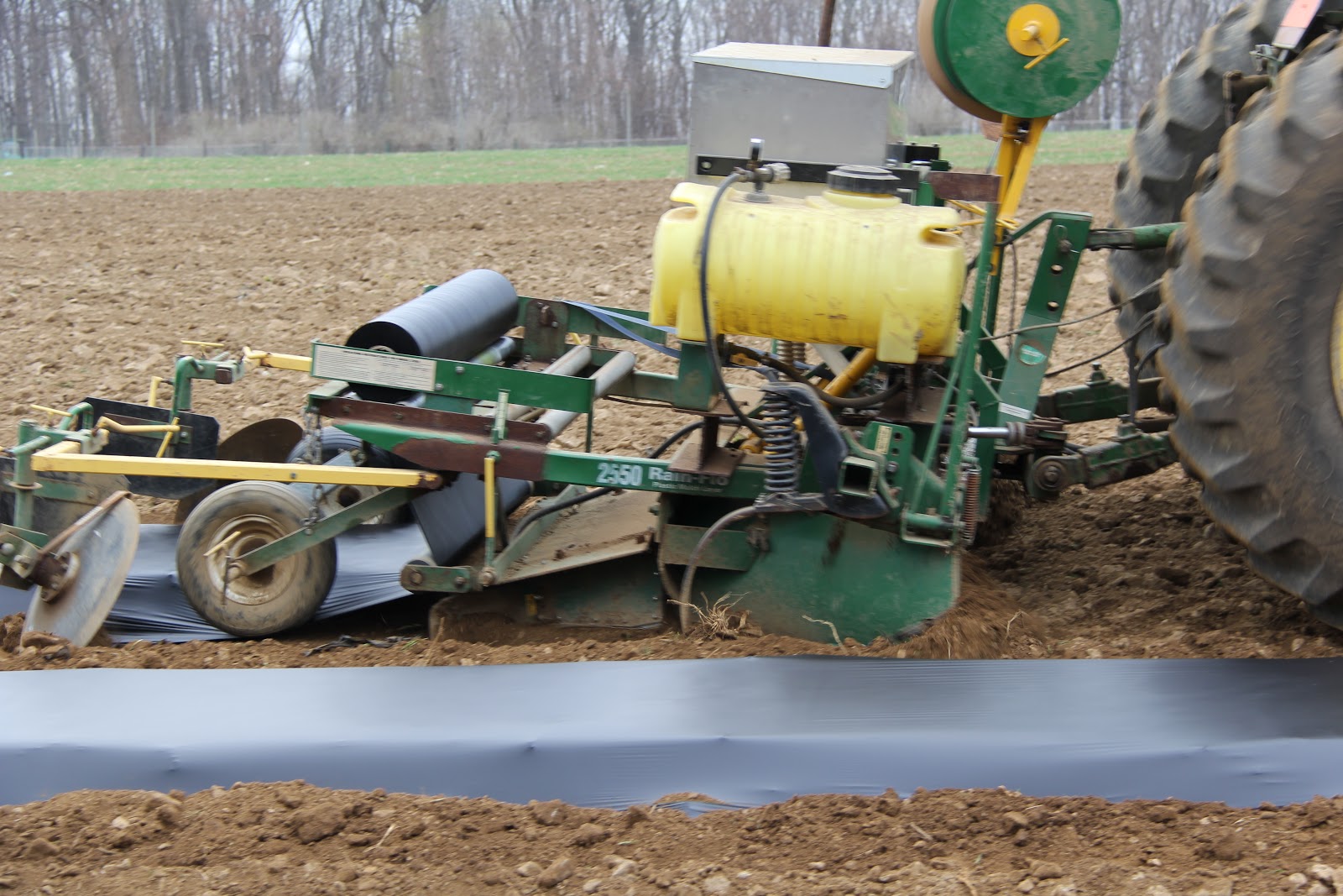 Stony Hill Farms CSA Laying Plastic Mulch Beds