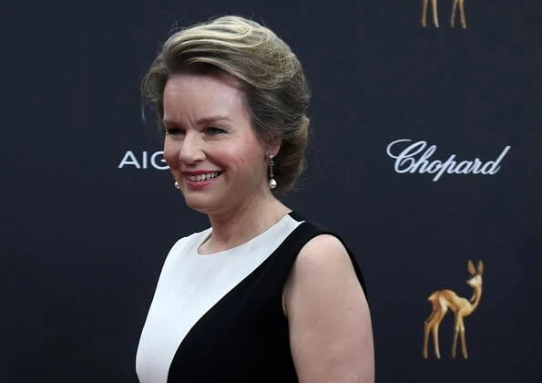 Queen Mathilde wore a two-tone crepe gown by Carolina Herrera. Bambi Awards at Festspielhaus in Baden-Baden