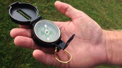 Guide book and magnetic compass 