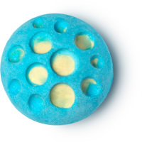 A light blue spherical bath bomb with white holes in the middle of it on a white background 