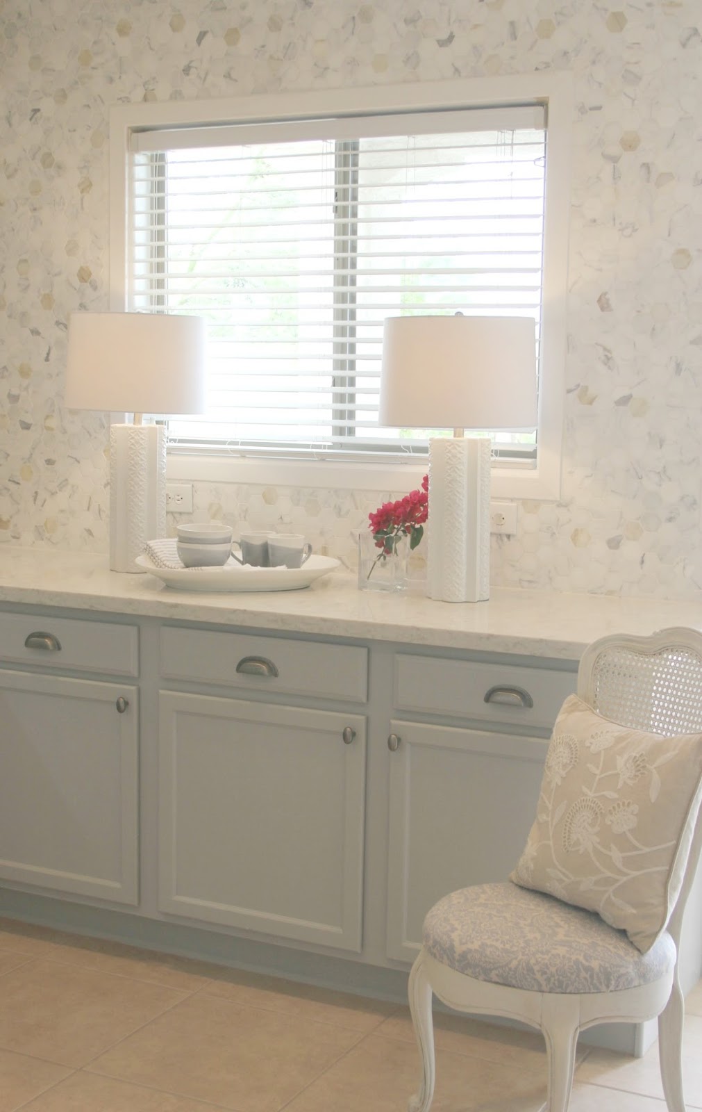 Serene Nordic French kitchen grey and white kitchen with marble statement wall and quartz countertop