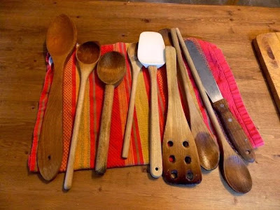 Mat with an array of wooden cooking utensils