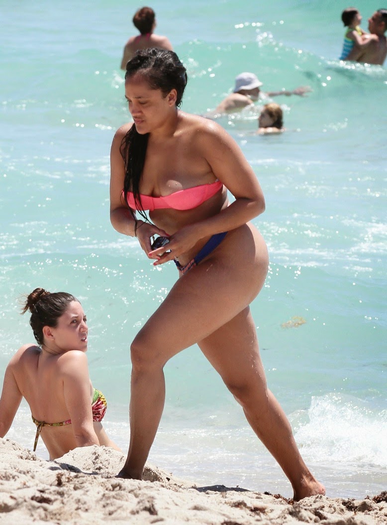 Girls Club member Natalie Nunn gets photographed on Miami Beach in a bikini...