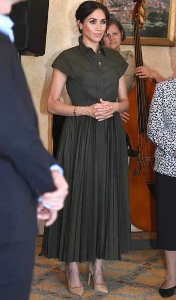 The Duchess wore a green maxi dress by US designer Brandon Maxwell. The Duchess wore Princess Diana’s gold and diamond butterfly earrings