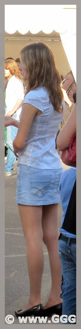 Girl in denim mini skirt on the street