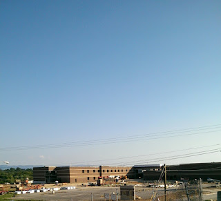 new high school with parking lot in front
