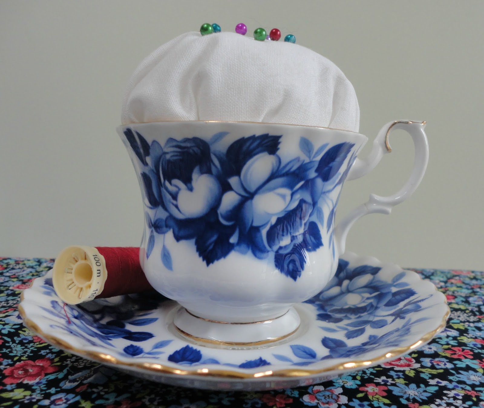 A vintage teacup pincushion