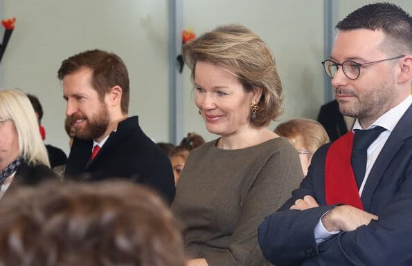 Queen Mathilde visited the 'Fly to the Moon' project of Maison des Ateliers Mons. Natan dress and Armani wool coat