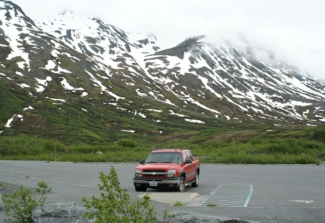 Red Chevrolet Avalanche at the parking lot of Worthington Glacier