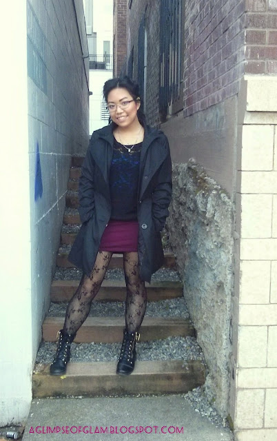 black raincoat outfit with maroon skirt and black fishnets