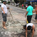 Motorista compra cimento e areia e tapa buraco em rua de Belém