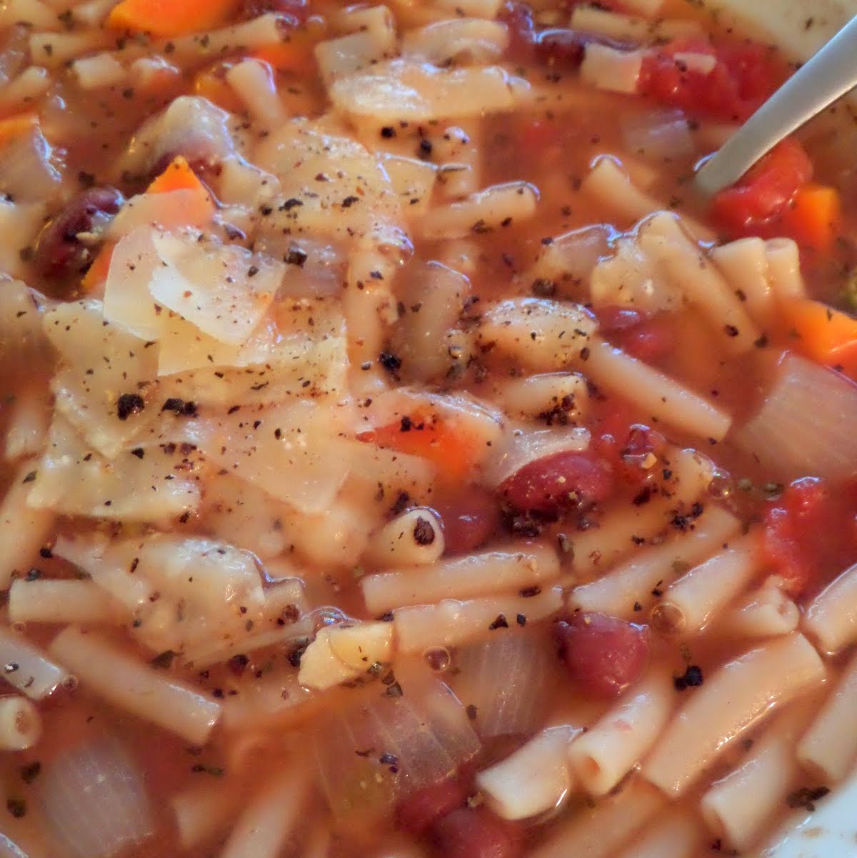 Minestrone Soup:  A simple, vegetarian, Italian style soup made with vegetables, beans, pasta, tomatoes and spices.