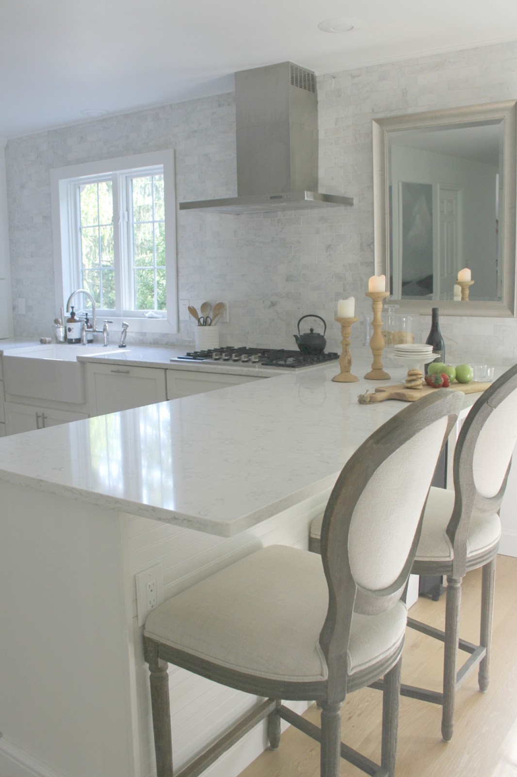 Serene white kitchen with Viatera quartz countertop (Minuet). Come tour my home and consider inexpensive approaches to simple decor. Find low cost timeless decorating ideas on Hellolovelystudio!