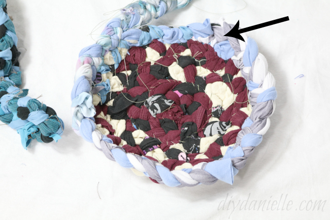 Once you've established your base, start sewing the walls to your basket on. Sewing a scrap basket: Forming the walls.
