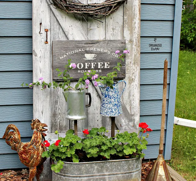 Coffee Themed Junk Garden Vignette with Barn Door Backdrop organizedclutter.net