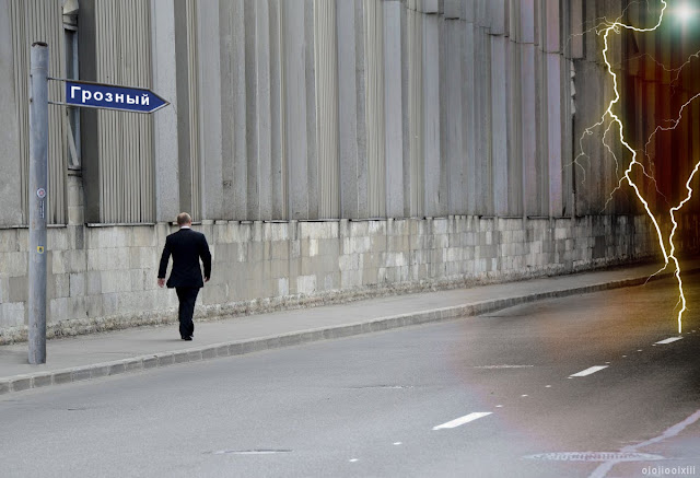 Владимир Пути (Vladimir Putin) walks on his own along an empty road towards a location signposted as Grozny. The path ahead seems fraught with peril; darkness and lightening-bolts await him.