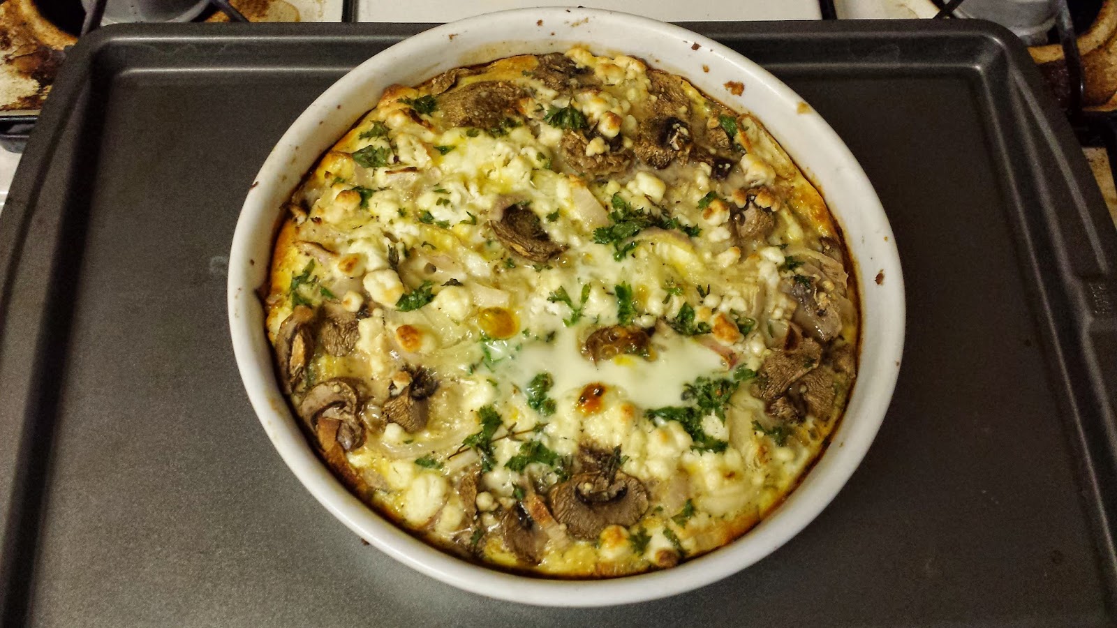 Half Baked Cooks Mushroom and Shallot Quiche with crumbled Goat Cheese