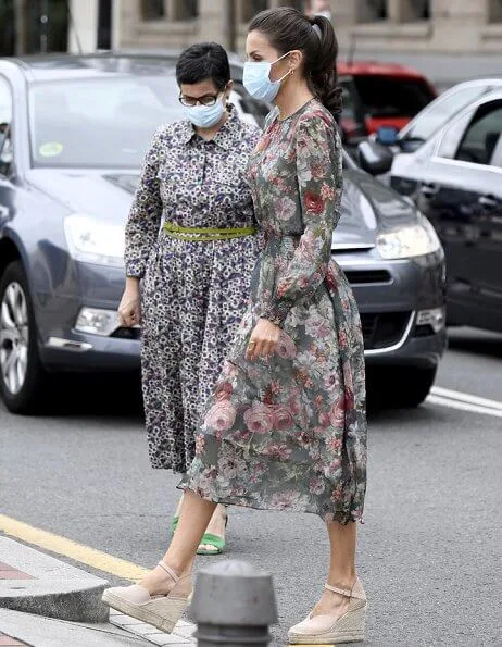 Queen Letizia wore a floral print midi dress from Zara, and canvas espadrille wedges by Macarena, Queen wore a gold earrings