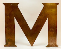 Other side of the copper flat cut letter with a rustic worn look perfect for creating a retro vintage feel