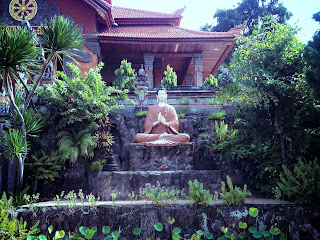 Buddha Statue In The Middle Of The Garden At Brahmavihara Arama Monastery North Bali
