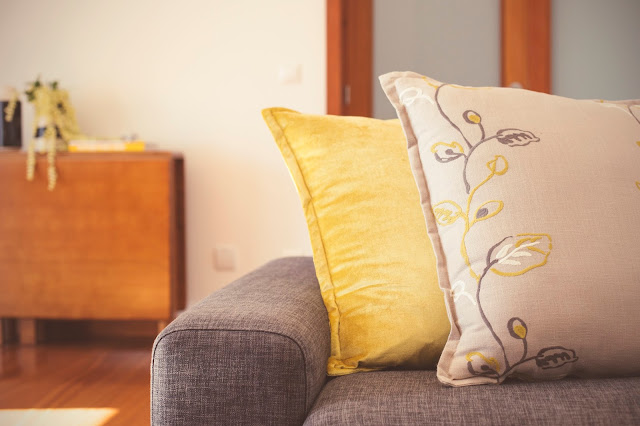 embroidered pillows grey and yellow living room