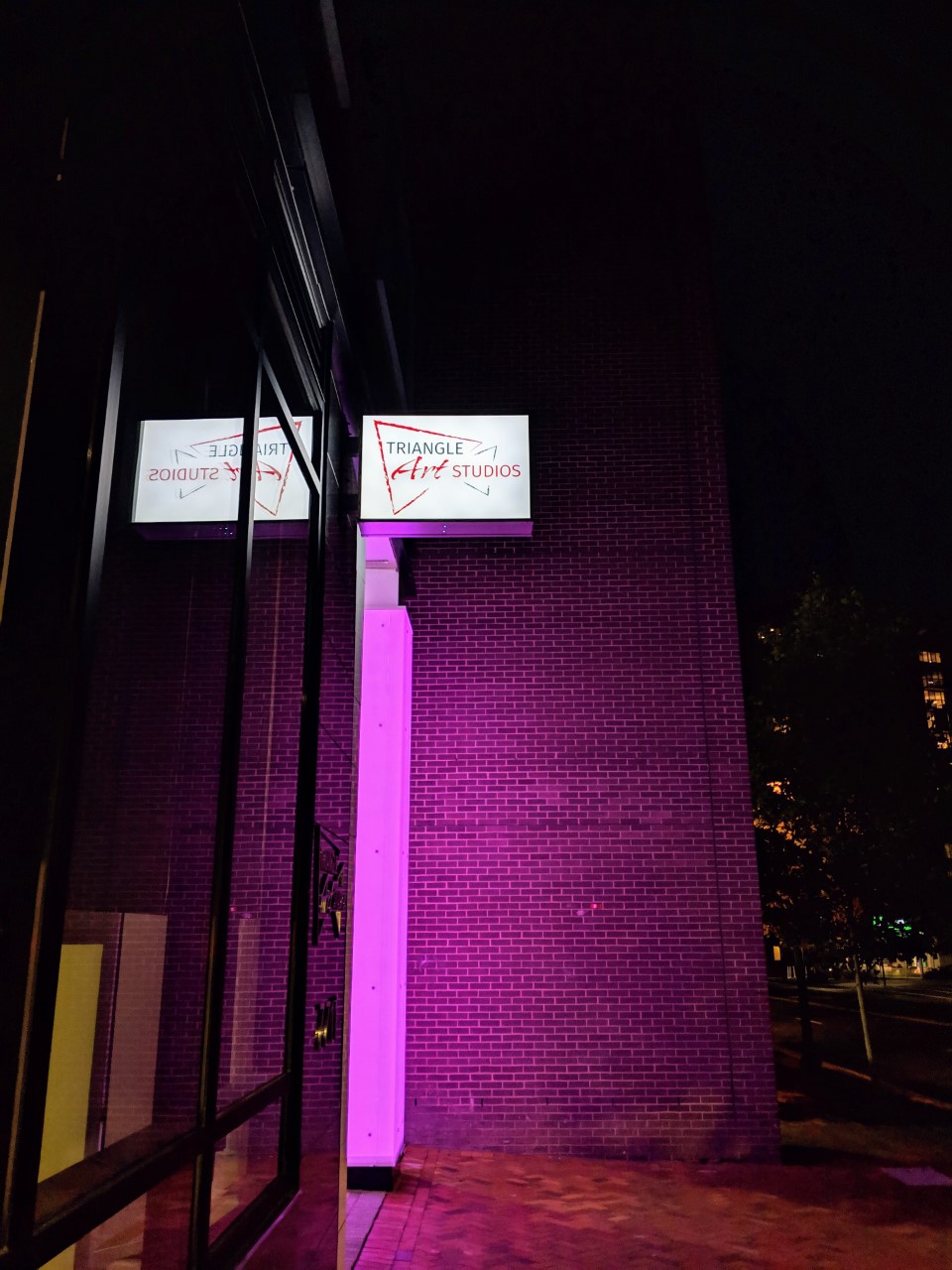 Robert Dyer Bethesda Row Sign lit at Triangle Art Studios