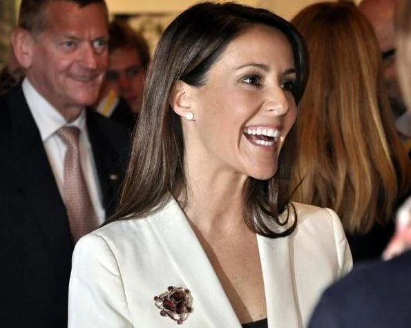 Princess Marie arrived at the fair with the Rector of the University of Southern Denmark. wore blazer and black trousers, diamond earrings