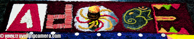 Diwali Rangoli,Art at Adobe, Rangoli is a traditional decorative folk art of India. These are decorative designs made on floors of living rooms and courtyards during Hindu festivals and are meant as sacred welcoming areas for the Hindu deities. The ancient symbols have been passed on through the ages, from each generation to the one that followed, thus keeping both the art form and the tradition alive. Rangoli and similar practices are followed in different Indian states; in Tamil Nadu, one has Kolam, Madanae in Rajasthan, Chowkpurna in Northern India, Alpana in Bengal, Aripana in Bihar, and so on. The purpose of Rangoli is decoration and it is thought to bring good luck. Teams make rangolis every year before Diwali at Adobe. However, this time the patterns were incredibly intricate and imaginative.Om is the sacred symbol of Hinduism, Buddhism, and Jainism and can often be seen in religious arts. Rangoli is no exception.The traditional rending of a new bride in a Doli. In medieval and ancient India and for a long time even in modern India, after marriage, dolis bourne on the shoulders of 4-6 men were used to transport the new bride to her husband's home. Marigold flowers (गेन्दा) are inseparable from Hindu Prayers and religios decorations. Idols of Deities are often adorned with garlands of marigold flowers and red roses.This is a clever integration of a peacock in the face of Lord Ganesh. While the peacock is the greatly revered in Hindu Scriptures, Lord Ganesh is the deity who the Hindus rely upon to take care of new entreprises. Beautiful colors and image! The peacock is also the National Bird of India.A pattern with the peacock in the center and outlined with marigold and rose petals.A Peacock is often referred to as a bird with a hundred eyes owing to the eye-like patterns in its tail feathers. The Kalash (a brass pot) is a symbol of abundance in Hinduism. It is often worshipped during the yagyas along with the deities in Arya Samaj branch of Hinduism. Full rendering of a peacock on the branch of a flowering plant with symbols of various Adobe Products in its tail. It is holding a scroll with the symbol of Adobe and the Sacred Swastik in its beak. Swastik, contrary to common knowledge, is an ancient holy symbol in Hinduism. Unfortunately, it was used by Nazis and after that the real, holy meaning seems to have been lost to the world. But in India, it is still used with a lot of respect in almost all religious ceremonies.  Lord Ganesh with his elephant head and human body. Lord Ganesh is widely worshipped along with Goddess Lakshmi (the Godess of Wealth) during diwali. Lord Ganesh, himself, is considered to be the God of New Beginnings, someone who removes hurdles. Another colorful design with the logos of various Adobe products, You can see the well know photoshop, Premiere Pro, Dreamweaver, Acrobat, InDesign etc.Diya's (earthen lamps) are used during diwali to decorate houses and businesses. They are shallow vessels made of clay or brass and have a cotton wick dipped in mustar oil.This design is more traditional with Om and a stark white color against a bright red. Two peacocks with their royal blue necks and bright green plumage. Peacocks seemed to rule the designs this year. A new age Ganesh with his vehicle, a mouse. If you look closely, the mouse if offering him an Apple that looks strikingly similar to the logo of the Software Giant of the same name. While the word Adobe has been written in a calligraphic script at the top. Cheeky!A close-up of the Kalash. This one is earthern but has been paited over with a metallic paint. Around it are typical colors of Hinduism, saffron and yellow. A close-up of the calligraphic Adobe.  Baby Ganesh, floating on a cloud, over a colorful carpet of Adobe Products. Whether this cloud is a spiritual cloud or the technical cloud, is open to interpretations. Another colorful and elaborate design with Ganesh and Swastik, The shape of a mango is another common shape in Indian arts. You'll find it used in abundance in mehndis (henna tattoos) and rangolis.Photoshop, flash, Dreamweaver, Bridge and other Adobe products around an Adobe symbol. A fancy earthen Diya full of blue rangoli color.Lord Ganesh, in his various forms, has inspired many artists. And as a result, his form has been used extensively in all kinds of arts, starting from Rangoli to paintings to sculpting. Simple, yet pretty.Adobe employees admiring one of the rangolis. Elephant, another symbol of Hinduism. This one's a tusker and is carrying Adobe on its back. Elephants are closely related to Lord Ganesh. The Rangolis are as colorful as Adobe itself. This particular Rangoli is of a dancing Lord Ganesh.Happy Diwali,  Rangoli, Art,  hinduism, Ganesh, Om, Religion, Art, Colorful