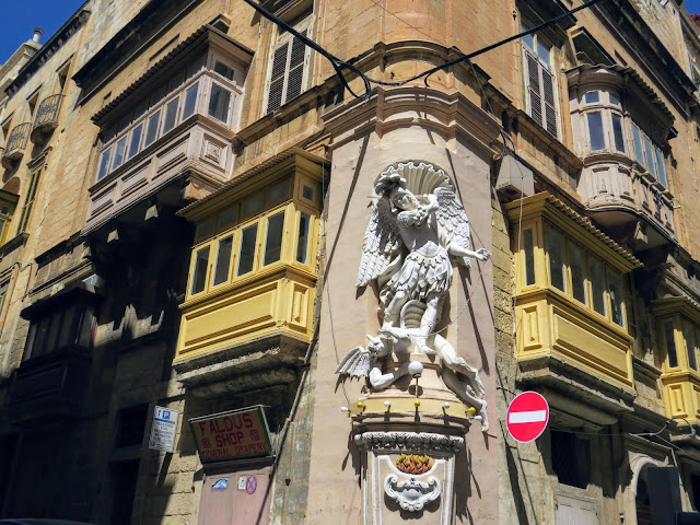 Things to do in Valletta: Check out the sculptures on otherwise ordinary buildings