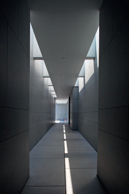 The dramatic top-lit service corridor