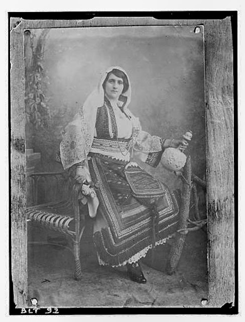 Reproduction of a photographic print of a Macedonian woman posing with a jug, village Negochani (Niki)