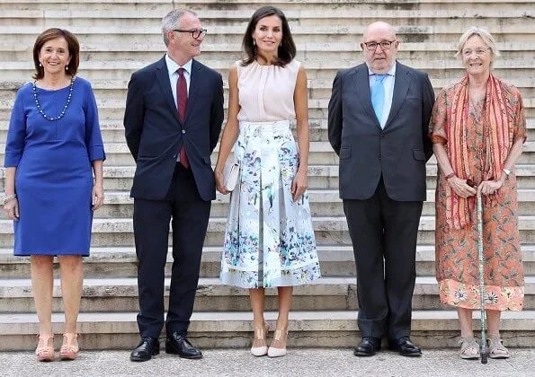 Queen Letizia wore Adolfo Dominguez floral print dress and Hugo Boss silk blouse, and Steve Madden pumps