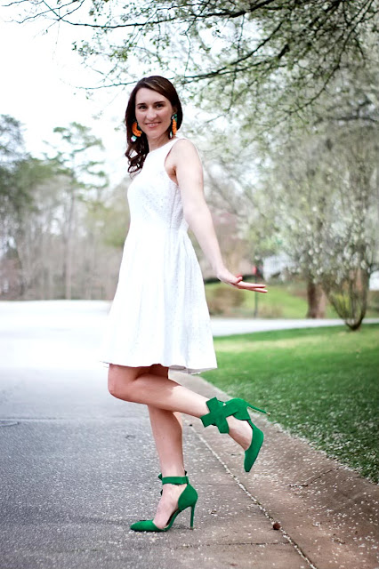 Fun St. Patrick's Day Outfit with white eyelet dress, statement bird earrings and green bow heels.  And good friends are lucky.