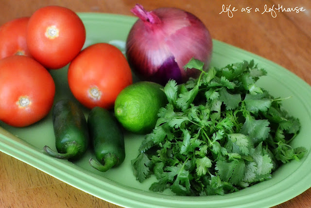 This homemade Pico de Gallo is full of diced tomatoes, jalapeños and onion with a few squeezes of fresh lime juice and a sprinkle of kosher salt. Life-in-the-Lofthouse.com 