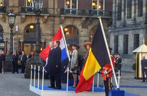 King Philippe and Queen Mathilde met with Queen Maxima and King Willem-Alexander at Dam Square in Amsterdam. Queen wore Natan Dress