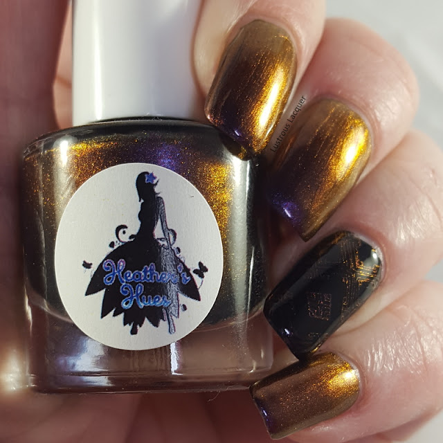 A purple to gold multi-chrome nail polish with hints of orange.