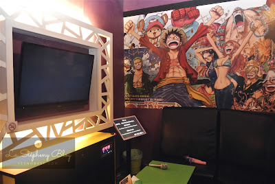 A room themed with one piece art drawing on wall in the iPOP karaoke setapak kuala lumpur