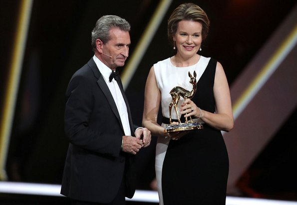 Queen Mathilde wore a two-tone crepe gown by Carolina Herrera. Bambi Awards at Festspielhaus. crystals and structure clutch