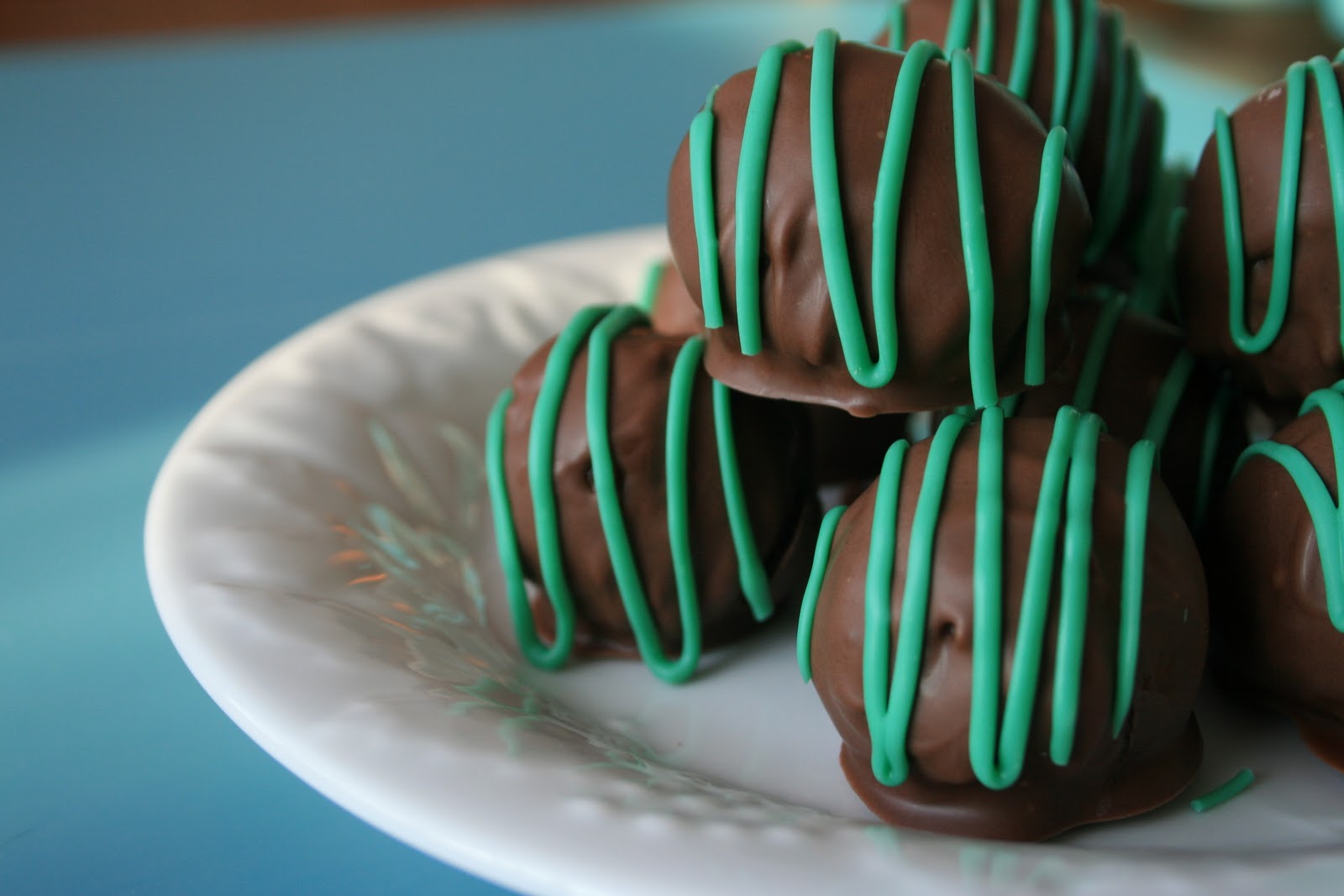 Share Dessert Cocoa Cream Cheese Cake Balls with Mint Drizzle