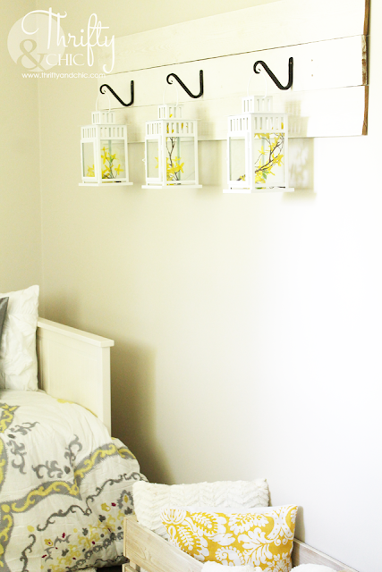 Cute way to hang lanterns, using hooks and reclaimed wood.