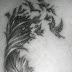 Broken feather and bird tattoo