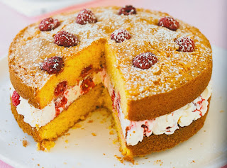 Raspberry and Lemon Polenta Cake: A rich layered sponge cake made with polenta and containing raspberries where the tow layers are sandwiched together with cream cheese