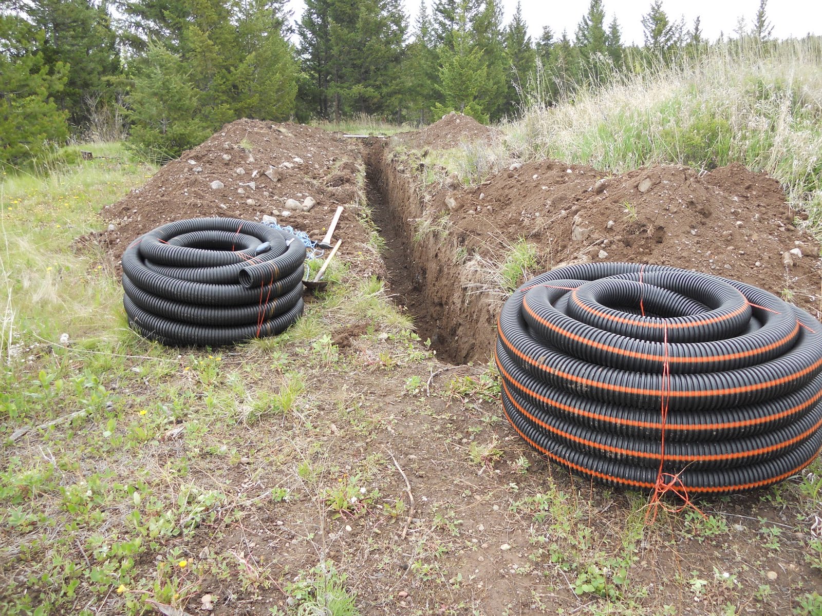 ZEN AND THE ART OF BUILDING A CABIN brought the earth tubes to the site and began the