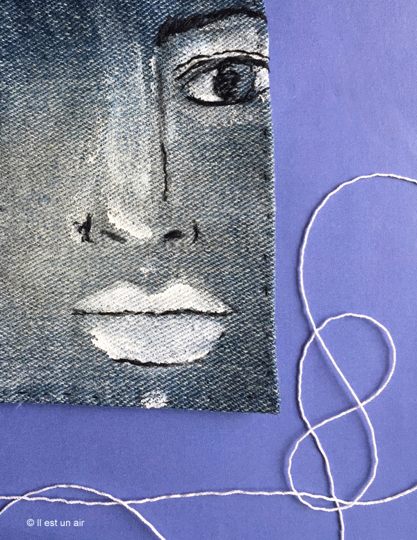 Visage brodé sur jean Visage brodé sur jean