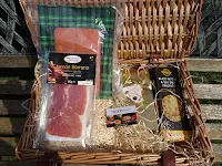 hamper filled with salmon and cheese in the sun