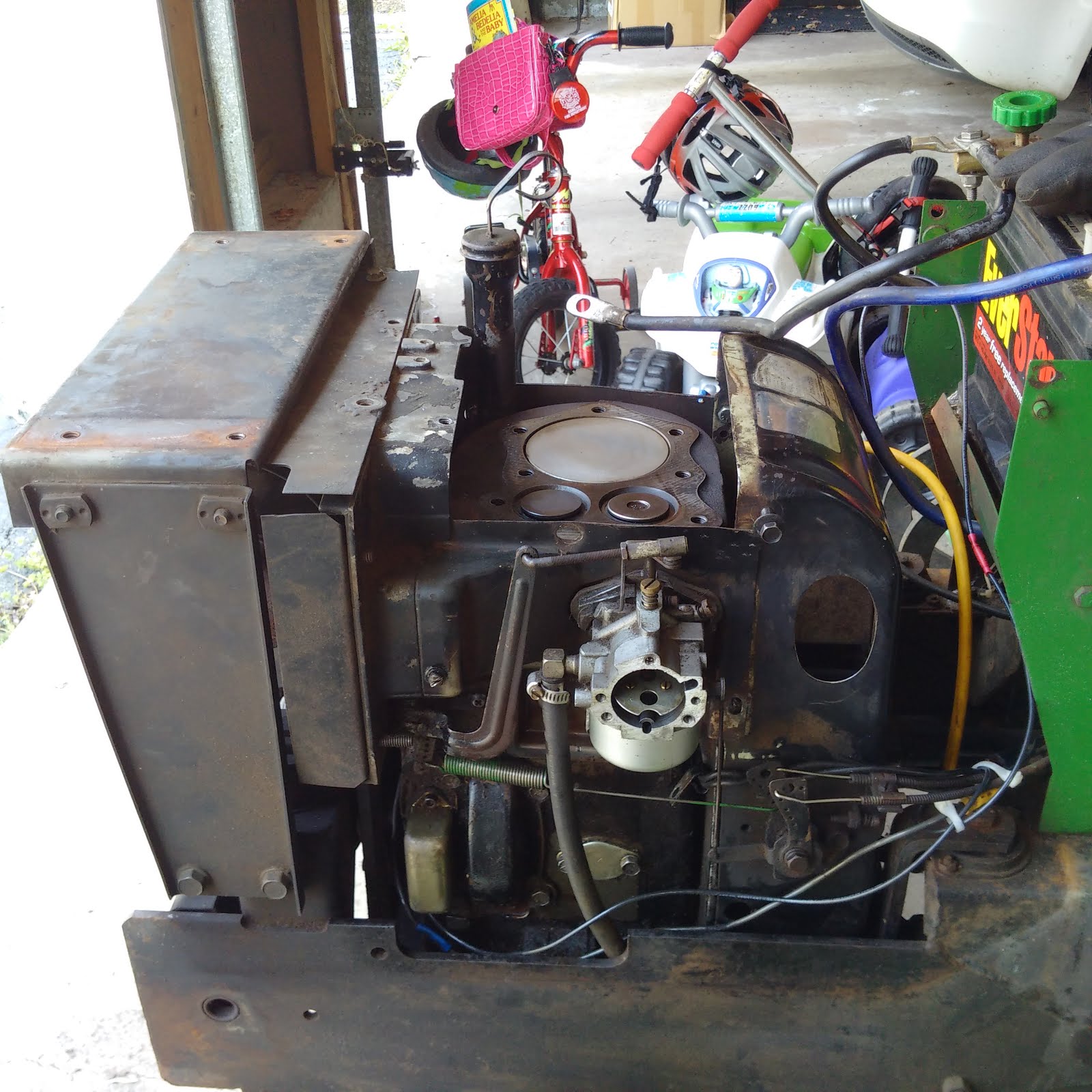 First, off came the hood, muffler and front frame where the hood joins on to.