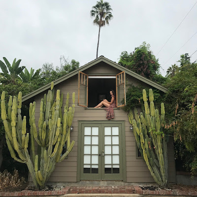 erin-elizabeth in the window A view from outside of The Dollhouse in Altadena, CA