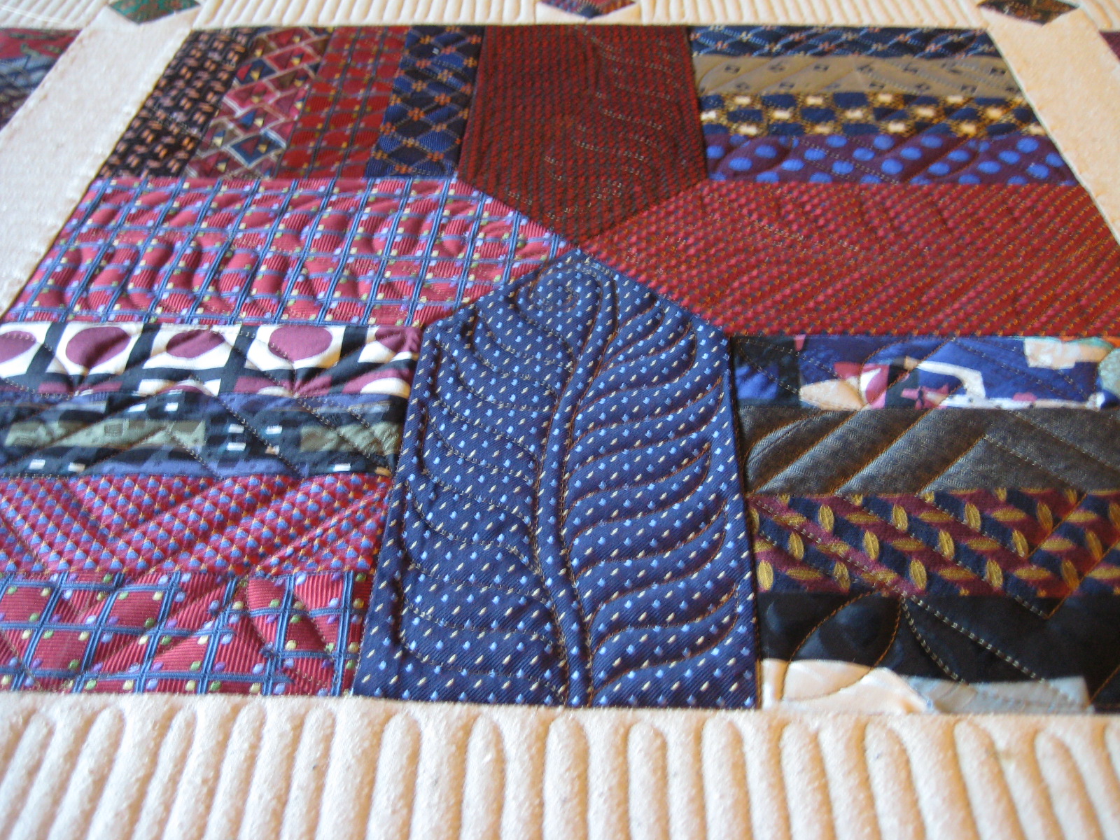 Threads on the floor: Quilting the Tie Quilt